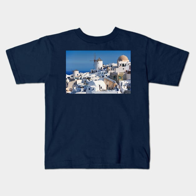 The famous windmills in Oia of Santorini, Greece Kids T-Shirt by Constantinos Iliopoulos Photography